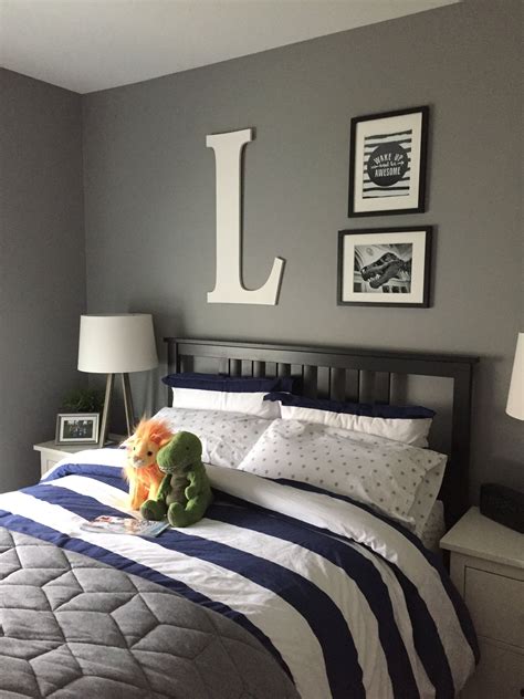 This boys bed features a bunk bed finished in navy blue paint, pairing up with the side table and shelving. Navy blue, gray, and white boy bedroom for my not so ...