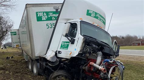 A head-on crash between a pickup and semi-truck kills a 61-year-old