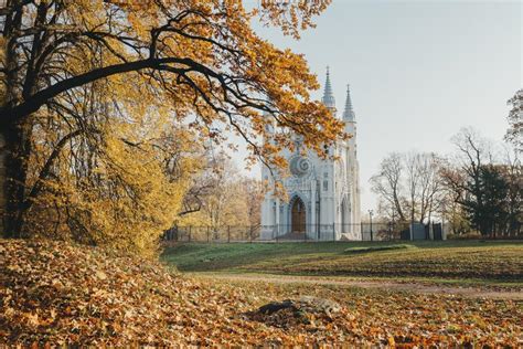 Catholic Chapel In The Park In The Autumn Sunny Day Trees With Golden