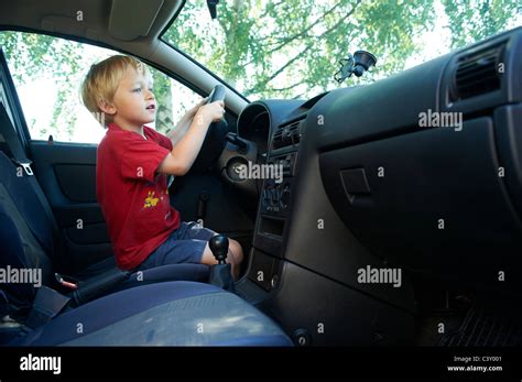 Child Blond Boy Driving Real Car Stock Photo Alamy