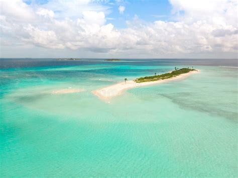 Picture Perfect Beach And Turquoise Lagoon On Small Tropical Island On