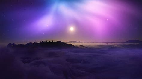 Mountain With Clouds In Background Of Blue And Purple Sky With Stars