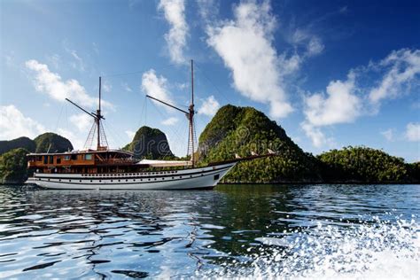 Sail Boat Between Islands Of Remote Archipelago Pulau Wayag Raja Ampat
