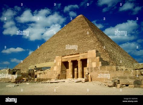 Restored mortuary temple facade and the Great Pyramid of Cheops at Giza