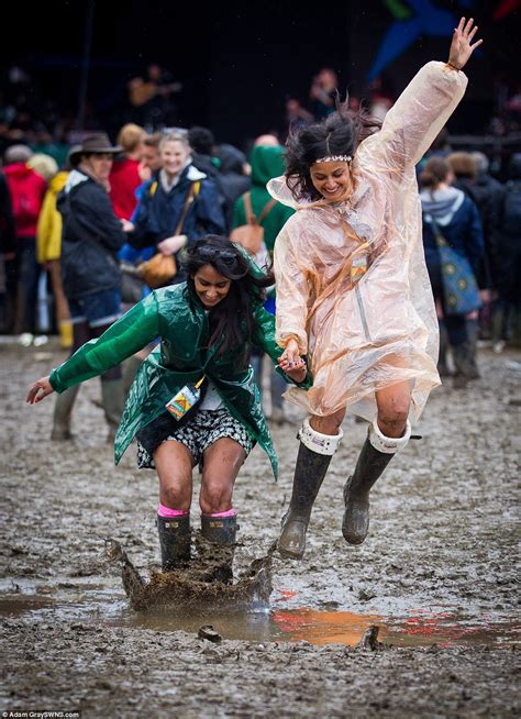 Glastonbury Weather Leaves A Mud Bath But Revellers Are Putting On A