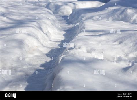Full Frame Texture Background Of A Path Shoveled In Deep Snow Just
