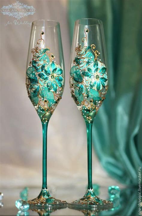 Two Wine Glasses With Green And Gold Decorations