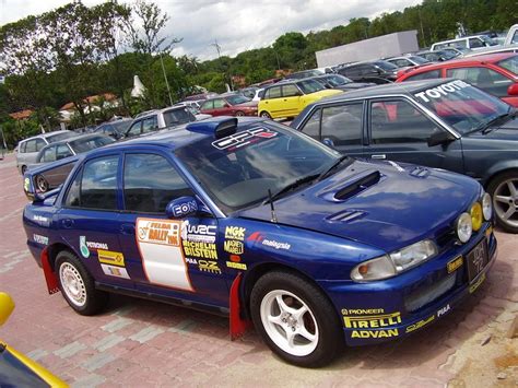 Wira rally car with mitsubishi lancer front body parts conversion but the bonnet was modified with subaru impreza style. OTOMOTIF