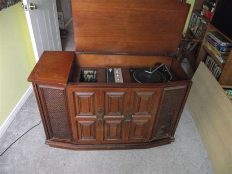 It features a surface for your record player, storage for your record collection, and a display for the record you are currently playing. Vintage Record Player Cabinet. | Vintage | Pinterest