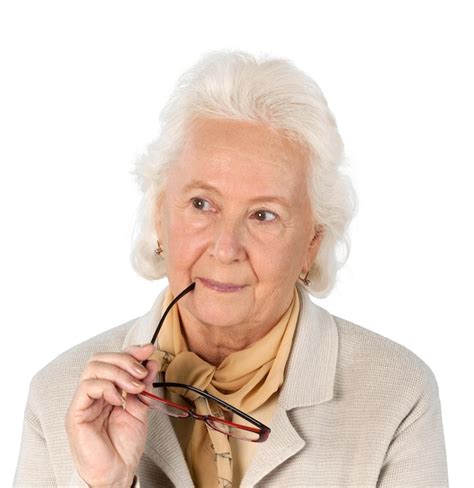 Premium Photo Portrait Of Thoughtful Old Woman Holding Glasses Isolated