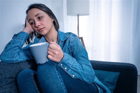 Single Young Woman Sad And Lonely At Home Stock Photo Image Of Couch