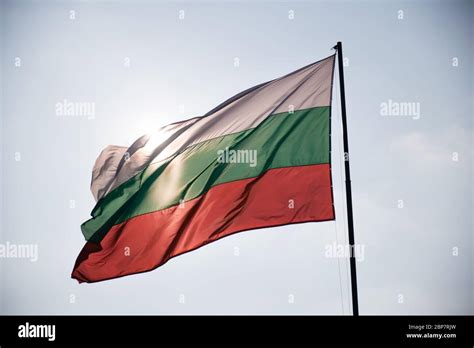 Bulgarian Flag Waving Wind Blowing It And Sun Illuminating From Behind