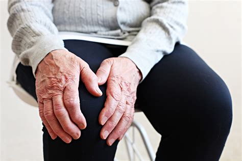 Elderly Woman Massaging The Knee Easing The Aches Joint Pain Concept Senior Old Lady