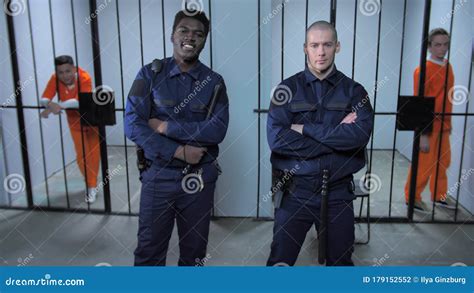 Prison Guards Stand Near Prison Cells Stock Photo Image Of Grate