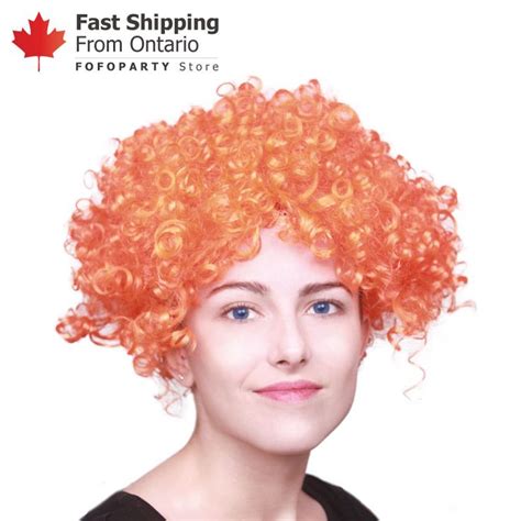 The Orange Afro Wig Features Thick Colorful Curls That Certainly Make