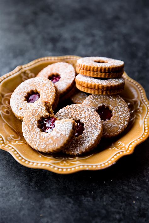 Eat your way around the world with this cookie collection of 16 cookie recipes for your holiday season. Raspberry Pistachio Linzer Cookies - Sallys Baking Addiction