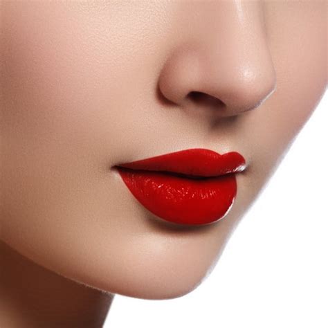 Close Up Shot Of Woman Lips With Glossy Red Lipstick