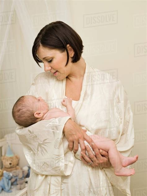 A Mother Holding A New Born Baby Stock Photo Dissolve