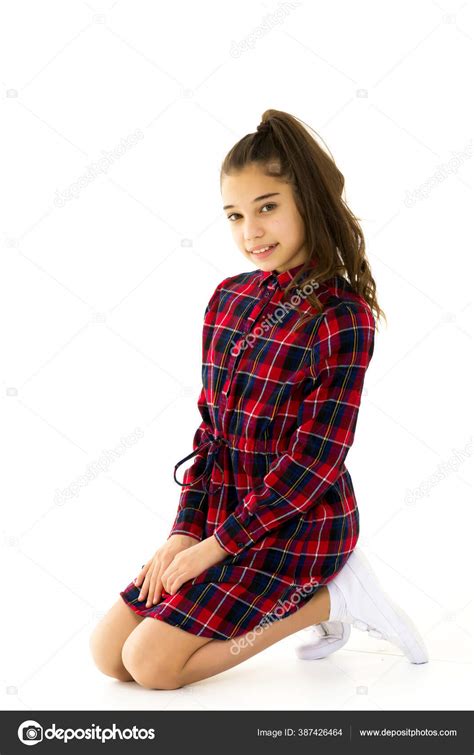 The Little Girl Is On Her Kneesisolated On A White Background Stock