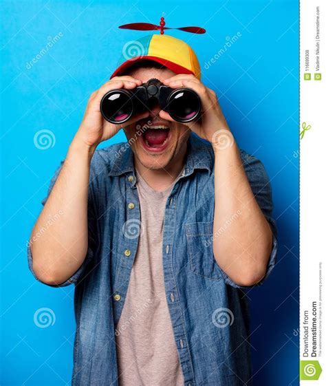 Young Nerd Man With Noob Hat Using A Binoculars Stock Photo Image Of