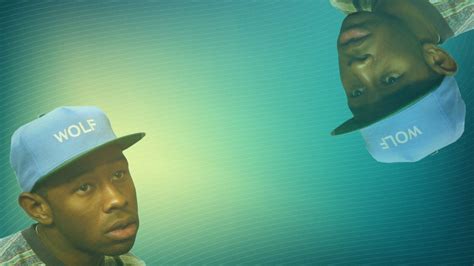 Tyler The Creator Is Wearing Wolf Word Blue Cap In A Blue Background Hd