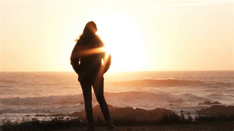 Woman At The Ocean Watching Beautiful Sunset Slow Motion Stock Video Footage 0025 Sbv 327064329