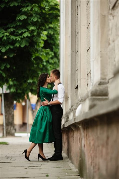 Free Photo Young Couple Giving A Passionate Kiss