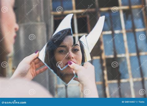 Beautiful Brunette Looking At Herself In A Mirror Stock Image Image
