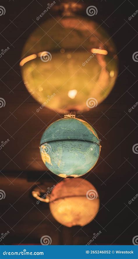 Vertical Of A World Globes Globuses Upside Down Stock Photo Image Of