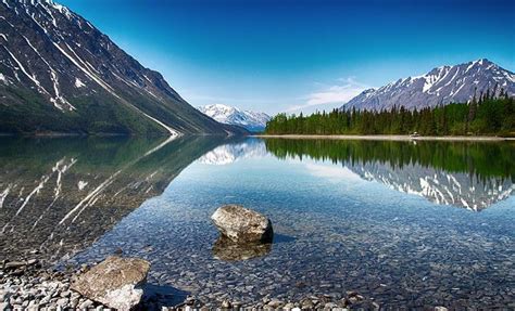 At Kathleen Lake Yukon Crystal Waters Are Backed By The Mountains Of