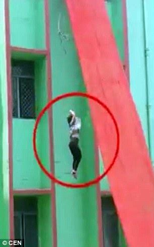 Horrific Moment Teacher Crashes FT To Concrete Floor When She Falls Off Slide During Mock