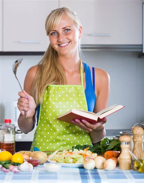 Girl With Long Hair Cooking Vegetables In Kitchen Stock Photo Image