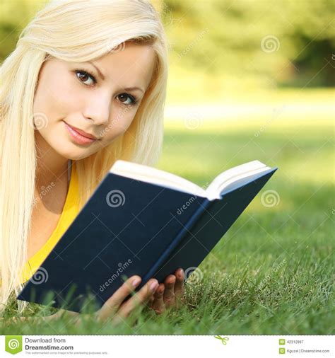 Blonde Girl With Book On Green Grass Beautiful Woman Outdoor Stock