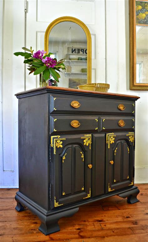 Mounted with gilt and etched bronze hardware. Heir and Space: A Maple Chest in Black and Gold