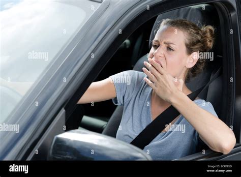 Tired Young Woman Driving And Yawning Stock Photo Alamy