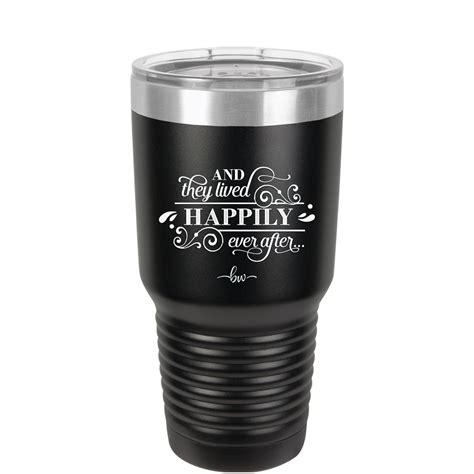 A Black And Silver Tumbler Cup With The Words Happily Together On Its Side