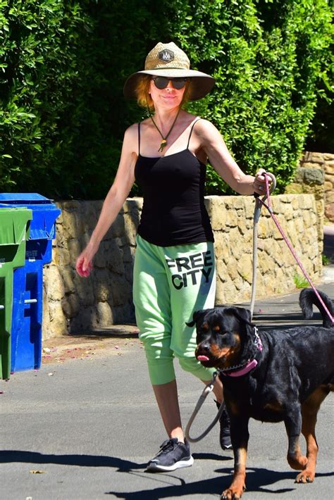Braless Lisa Rinna Has A Hard Time Holding Her Dogs While Out During A