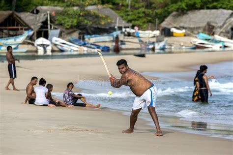 A Man Playing Cricket On Arugam Bay Beach In Sri Lanka Editorial Stock
