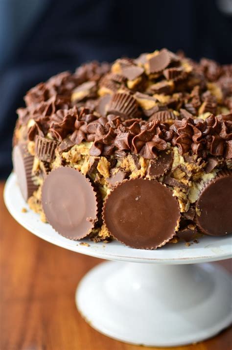The secret ingredient for chocolate cupcakes with peanut butter frosting is a reese's peanut butter do you love reese's peanut butter cups as much as my family does? Outrageous Reese's Peanut Butter Cup Cake | Reeses ...
