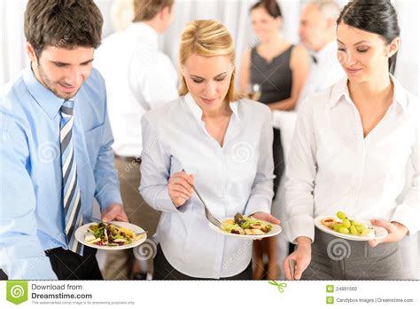 Business Colleagues Serve Themselves At Buffet Stock Photo Image Of