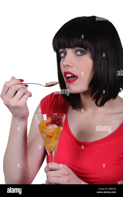 Seductive Brunette Eating Fruit Salad Stock Photo Alamy