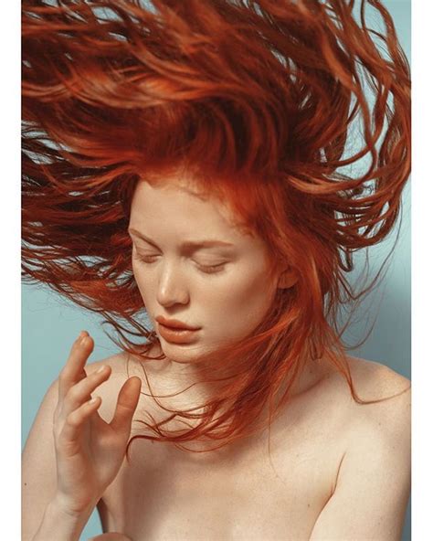 A Woman With Red Hair Blowing In The Wind On Her Instagram Page Which