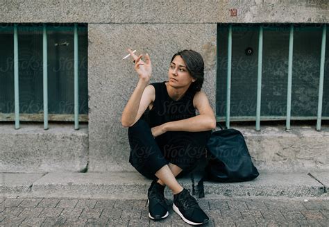 Portrait Of Real Lesbian Woman Smoking On The Street Del Colaborador De Stocksy Alexey Kuzma