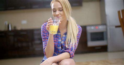 Sexy Bottomless Woman Wearing Blue Violet Shirt Only Drinking Orange