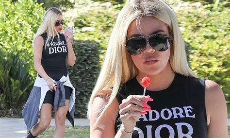 Khloe Kardashian Dons Clinging Gym Outfit As She Sucks On A Lollipop As