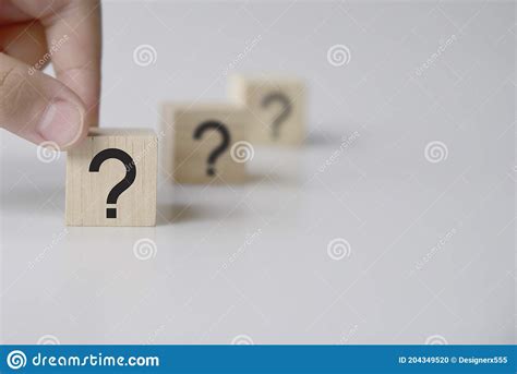 Questions Mark Word In Wooden Cube Block On Table Background Faq