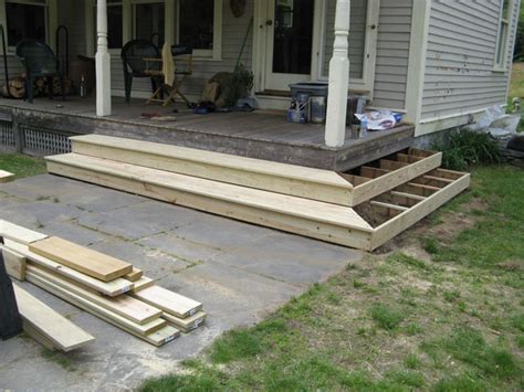 Front porch steps, if designed correctly, can make a small porch appear larger or a large porch more grand! Porch Steps | Vermont Carpentry Designs