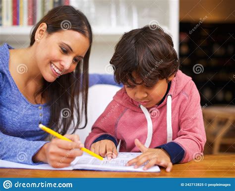 Learning With Love Shot Of A Mother Helping Her Son With His Homework