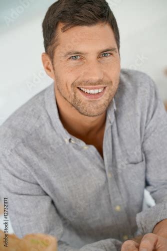 Portrait Of Handsome 40 Year Old Man With Arms Crossed Stock Photo