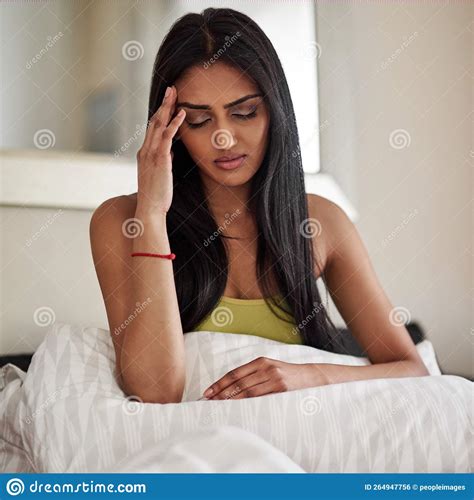 Waking Up With A Headache Is The Worst A Young Woman Waking Up In The Morning Feeling Unwell